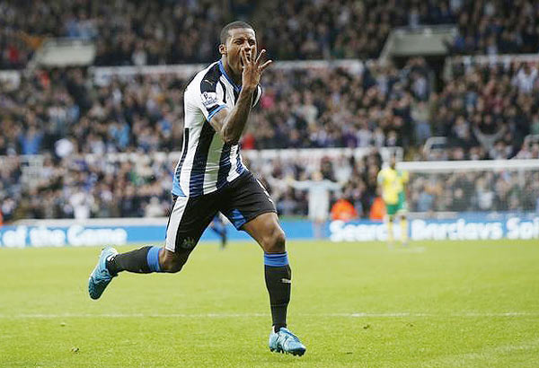 Georginio Wijnaldum celebrates scoring the sixth goal for Newcastle United and his fourth against Norwich City during their English Premier League match at St James' Park in Newcastle on Sunday