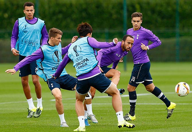 Andros Townsend of Tottenham Hotspur (second right) passes the ball during a training session  