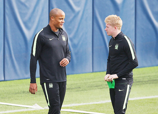 Manchester City's Vincent Kompany and Kevin De Bruyne talk during a training session at the City Football Academy