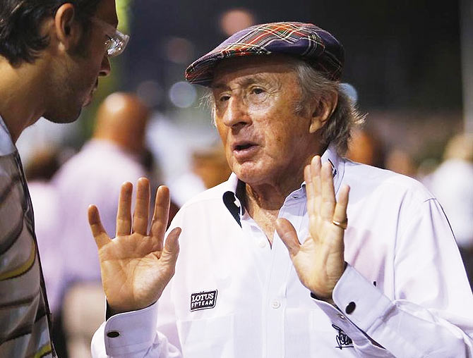Three-time Formula One Grand Prix world champion Stewart gestures