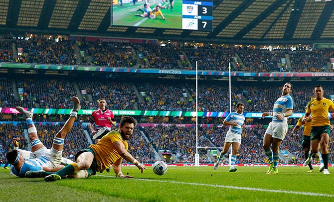 Adam Ashley-Cooper of Australia dives over to scores his sides second try 