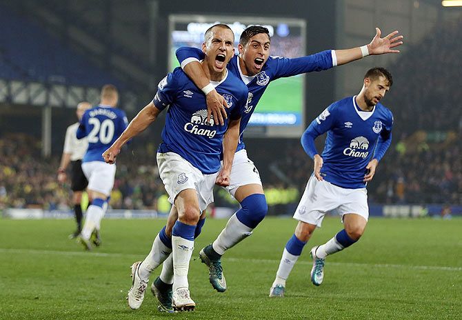 Everton's Leon Osman celebrates with team-mate Ramiro Funes Mori after scoring his side's first goal against Norwich City at Goodison Park