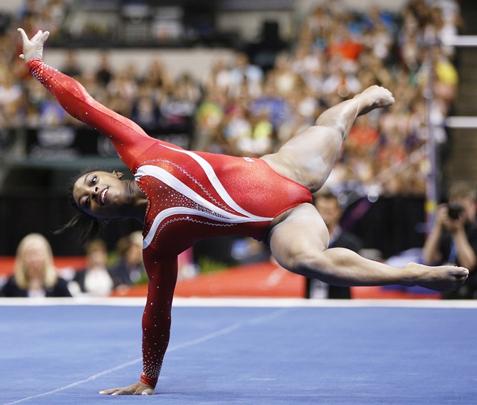 Simone Biles competes.