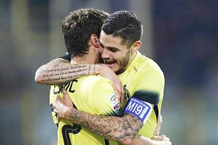 Inter Milan's Mauro Icardi (right) celebrates with teammate Adem Ljajic after scoring against Bologna during their Serie A match at the Renato Dall'Ara stadium in Bologna on Tuesday