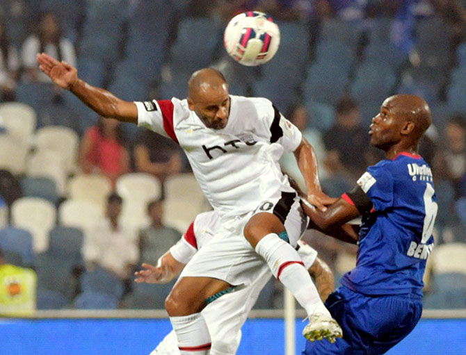 Mumbai City FC (Blue) and NorthEast United FC (White) players in action during the ISL 