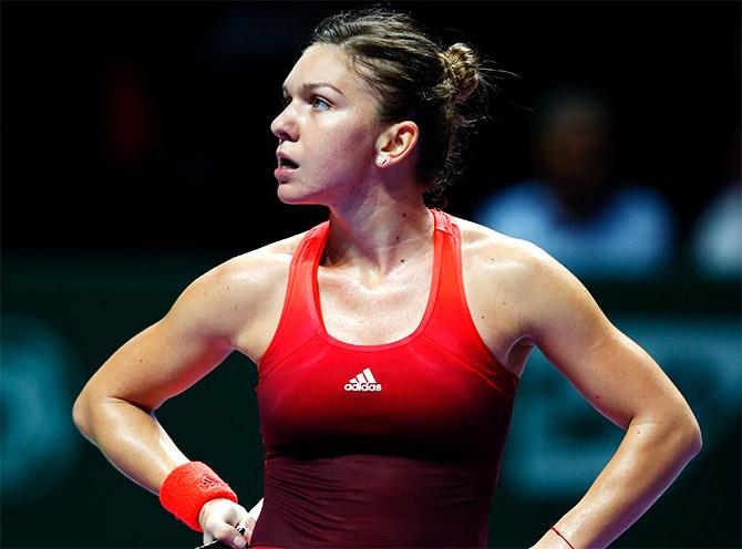 Simona Halep of Romania reacts  