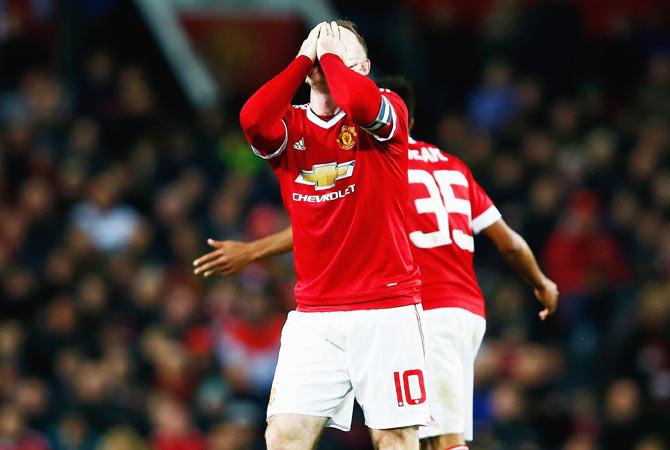 Manchester United's Wayne Rooney reacts during their Capital One League Cup fourth round match against Middlesbrough at Old Trafford in Manchester on Wednesday