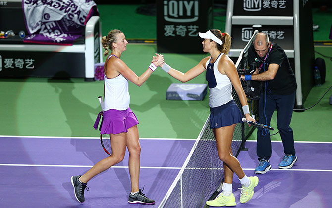 Garbine Muguruza of Spain shakes hands with Petra Kvitova of Czech Republic 