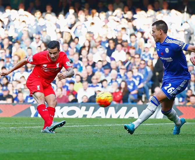 Philippe Coutinho of Liverpool scores