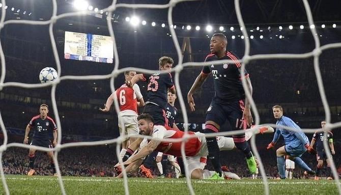 Olivier Giroud scores the first goal for Arsenal during their Champions League group match against Bayern Munich at the Emirates in London on Tuesday