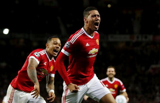 Manchester United's Chris Smalling celebrates scoring the second goal against VfL Wolfsburg during their UEFA Champions League Group B match at Old Trafford on Wednesday