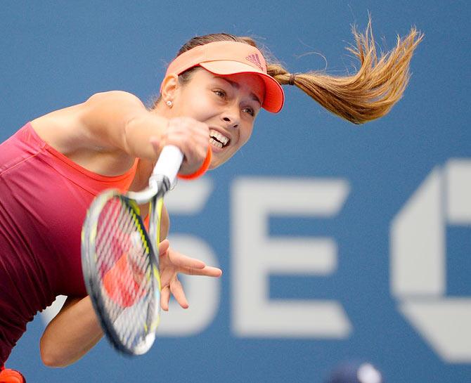 Serbia's Ana Ivanovic serves to Slovakia's Dominika Cibulkova during their opening round match of the 2015 US Open on Monday