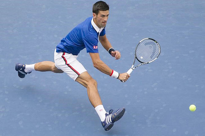 Serbia's Novak Djokovic chases down a return against Brazil's Joao Souza