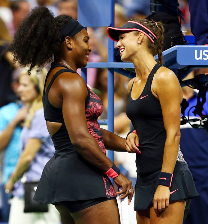 Serena Williams talks with Vitalia Diatchenko after their first round match