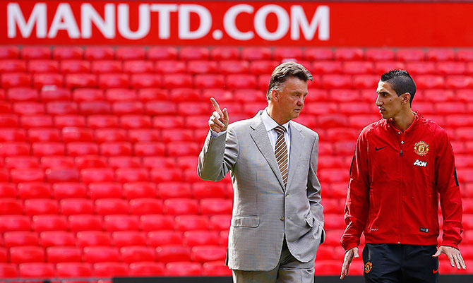 Manchester United's new signing Angel Di Maria (right) speaks with manager Louis van Gaal