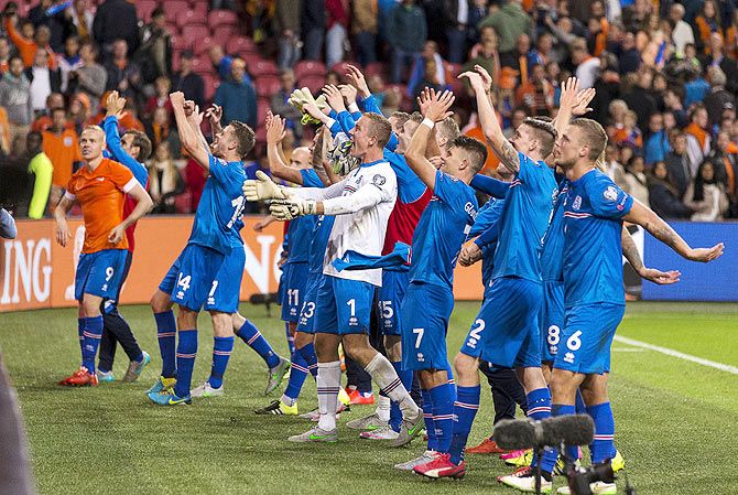 Iceland's team celebrate their victory over the Netherlands after their Euro 2016 qualifying match in Amsterdam, the Netherlands on Thursday