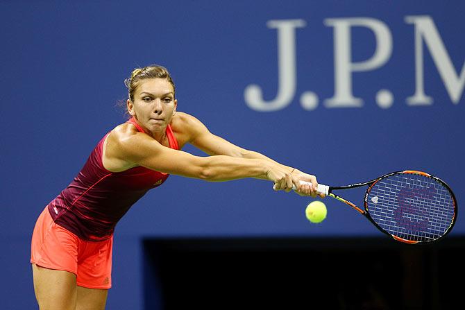 Romania's Simona Halep returns a shot to USA's Shelby Rogers