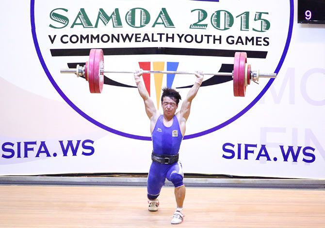India's Jamjang Deru lifts during the Men 56kg A Weightlifting at the Tuanaimato Sports Facility on Day 1 of the Samoa 2015 Commonwealth Youth Games in Apia, Samoa, on Monday