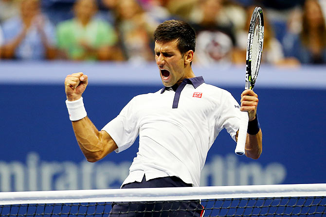 Serbia's Novak Djokovic reacts on winning a point against Spain's Roberto Bautista Agut
