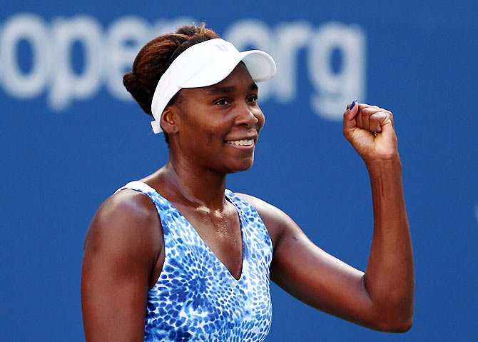 USA's Venus Williams celebrates after defeating Estonia's Anett Kontaveit in their Women's singles fourth round match of the 2015 US Open at the USTA Billie Jean King National Tennis Center at Flushing meadows on Sunday