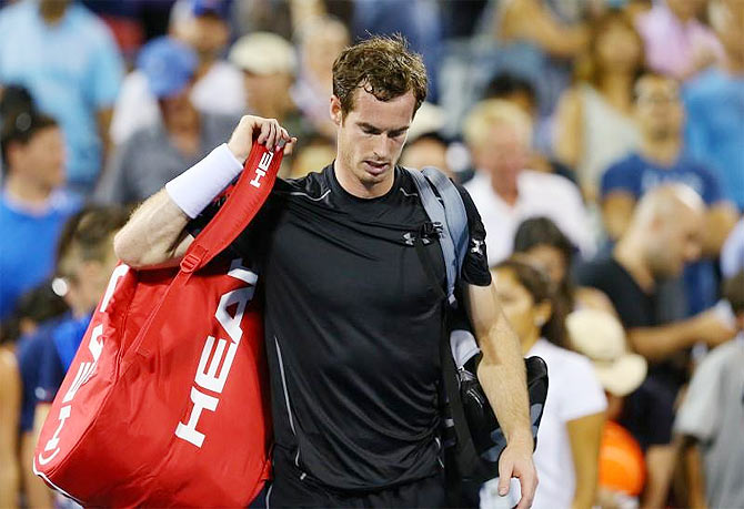 Great Britain's Andy Murray leaves the court after losing to South Africa's Kevin Anderson in the fourth round of the US Open tennis tournament at USTA Billie Jean King National Tennis Center in New York on Monday