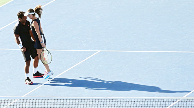 Leander Paes and Martina Hingis celebrate on winning the title on Friday