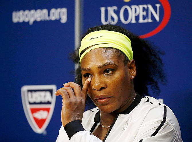USA's Serena Williams listens to a reporter's question during a post-match press conference following her loss to Italy's Roberta Vinci in their women's singles semi-final match at the US Open Championships in New York on Friday
