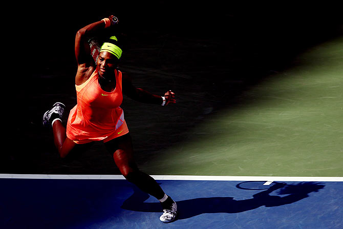 Serena Williams returns a shot to Roberta Vinci