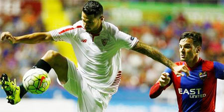 Players vie for possession during the La Liga match between Sevilla and Levante