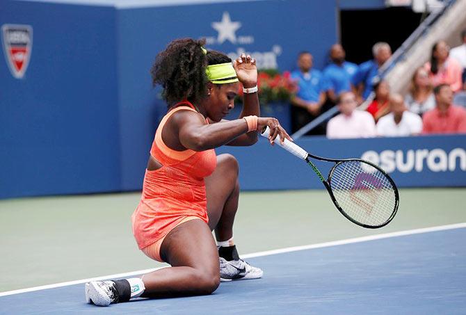 USA's Serena Williams slips in the third set during her US Open semi-final against Italy's Roberta Vinci in New York on Friday