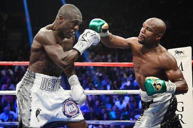 Floyd Mayweather and Andre Berto box during their WBA/WBC welterweight title bout at MGM Grand Garden Arena in Las Vegas on Saturday