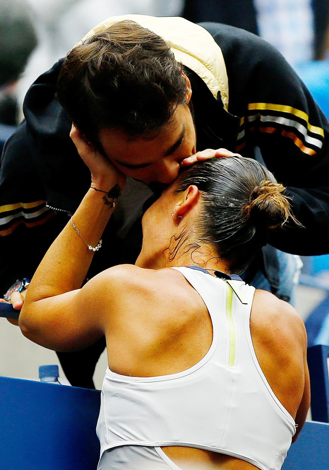 Flavia Pennetta celebrates with boyfriend and Italian tennis player Fabio Fognini