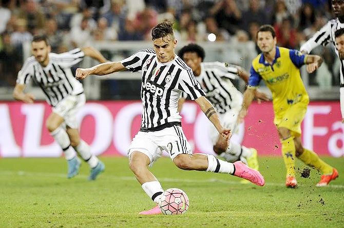 Juventus' Paulo Dybala shoots to score a penalty against Chievo Verona during their Serie A match at Juventus Stadium in Turin on Saturday