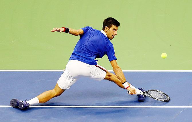 Novak Djokovic returns a shot