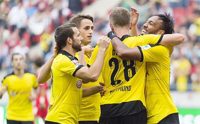 Borussia Dortmund players celebrate with goal-scorer Pierre-Emerick Aubameyang (right) during their win over Hanover in their Bundesliga match on Saturday