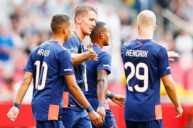 PSV's Luuk de Jong (centre) celebrates scoring