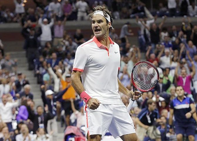 Switzerland's Roger Federer celebrates winning the second set against Serbia's Novak Djokovic during their men's singles final match at the US Open Championships tennis tournament in New York on Sunday