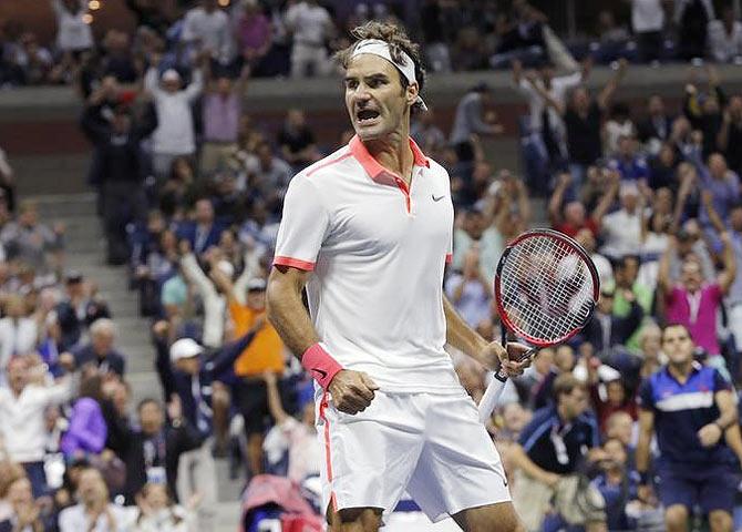 Switzerland's Roger Federer celebrates winning the second set against Serbia's Novak Djokovic during their men's singles final match at the US Open Championships tennis tournament in New York on Sunday