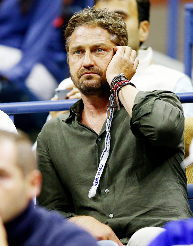 Gerard Butler watches the US Open Men's final between Novak Djokovic and Roger Federer on Sunday