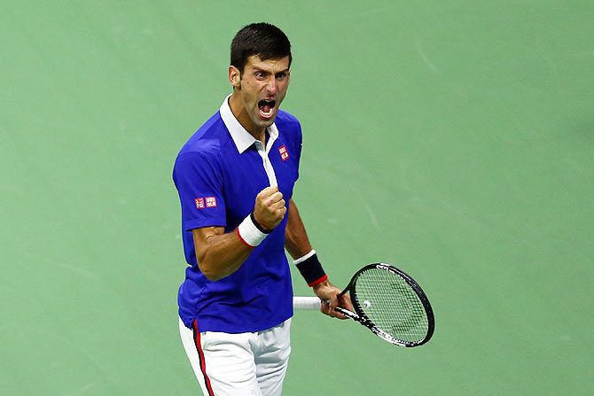 Serbia's Novak Djokovic celebrates a point against Switzerland's Roger Federer during their US Open men's singles final on Sunday