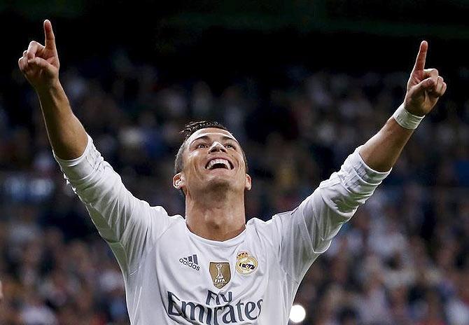 Real Madrid's Cristiano Ronaldo celebrates his second goal against Shakhtar Donetsk during their Champions League match at Santiago Bernabeu stadium in Madrid on Tuesday