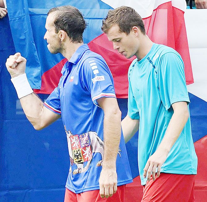 Czech Republics Adam Pavlasek (right) and Radek Stepanek celebrate after winning their doubles tennis match against India’s Rohan Bopanna and Leander Paes during the second day’s play at the Davis Cup World Group play-off tie in New Delhi on Saturday