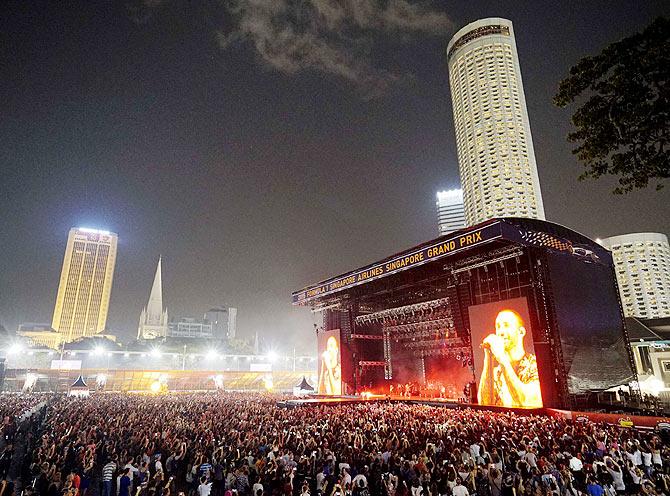 A big screen shows Adam Levine in concert at the Marina Bay street circuit in Singapore on Saturday