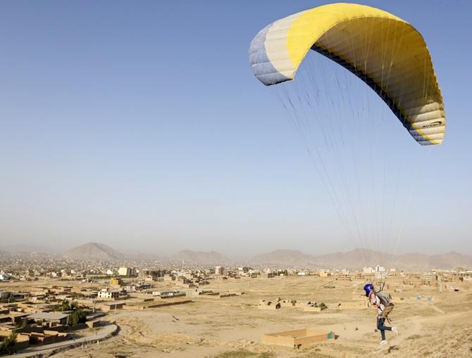 Afghan paraglider Zakia Mohammadi, 21, flies