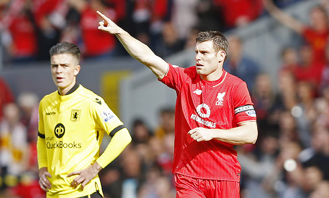 James Milner celebrates scoring the first goal for Liverpool against Aston Villa on Saturday