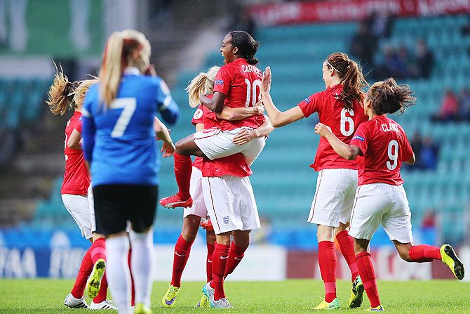 England's Danielle Carter celebrates with teammates after scoring during UEFA Women's Euro 2017 Qualifier against Estonia at A Le Coq Arena in Tallinn, Estonia on Monday, September 21