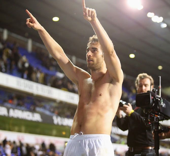 Arsenal's Mathieu Flamini celebrates after victory against Tottenham Hotspur during their League Cup 4th round match at White Hart Lane in London on Wednesday