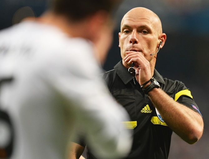 Referee Howard Webb blows his whistle