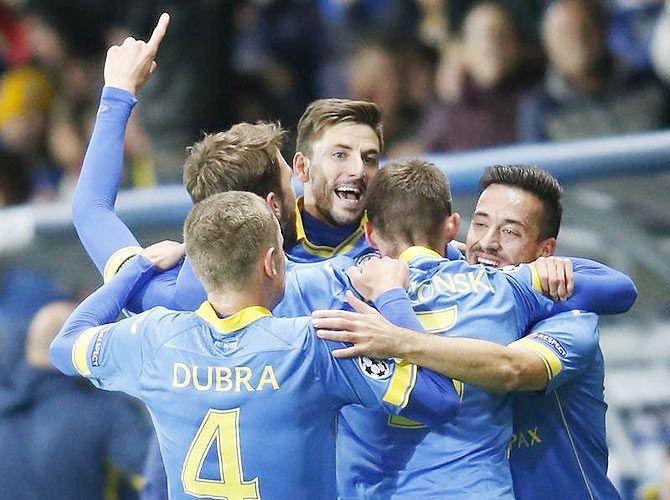 BATE Borisov's Filip Mladenovic (centre) celebrates with teammates after scoring against AS Roma during their Champions League Group E match at the Borisov Arena outside Minsk, in Belarus on Tuesday