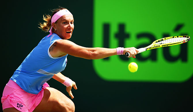 Russia's Svetlana Kuznetsova plays a backhand against Switzerland's Timea Bacsinszky